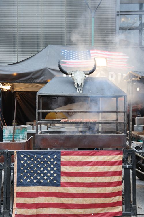 American flag and BBQ grill outdoors – celebrating veteran-owned BBQ brands